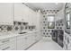 Well-equipped laundry room with ample storage, modern appliances, and stylish design elements for functionality at 284 Hook St, Alpharetta, GA 30009