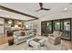 Open concept living area with hardwood floors, comfortable seating, and access to the outdoor living space at 284 Hook St, Alpharetta, GA 30009