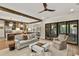 Open living space with beamed ceilings, comfortable seating, and sliding door to outside at 284 Hook St, Alpharetta, GA 30009