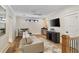 Bright living area featuring hardwood floors, recessed lighting, and a comfortable gray sofa at 284 Hook St, Alpharetta, GA 30009