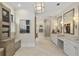 Luxurious main bathroom featuring dual vanities, a walk-in shower, and a separate area with built-in storage at 284 Hook St, Alpharetta, GA 30009