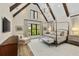 Spacious main bedroom with high ceilings, exposed beams, and large windows offering ample natural light at 284 Hook St, Alpharetta, GA 30009