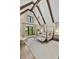Bright main bedroom featuring vaulted ceilings, exposed beams and large windows offering great natural light at 284 Hook St, Alpharetta, GA 30009
