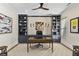 Spacious home office featuring built-in shelving, stylish décor, and ample natural light at 284 Hook St, Alpharetta, GA 30009