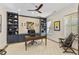 Comfortable home office with custom built-ins, stylish decor, and a ceiling fan at 284 Hook St, Alpharetta, GA 30009