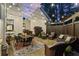 Covered outdoor patio featuring comfortable seating, stylish decor and beautiful string lights overhead at 284 Hook St, Alpharetta, GA 30009