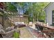 Spacious patio area with comfortable seating, a dining table, and an outdoor grill, ideal for gatherings at 284 Hook St, Alpharetta, GA 30009