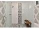 Modern shower showcasing decorative tile accents and a glass enclosure at 284 Hook St, Alpharetta, GA 30009
