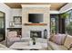 Inviting sunroom featuring a fireplace, comfortable seating, and natural light at 284 Hook St, Alpharetta, GA 30009