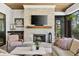 Charming sunroom featuring a brick fireplace and comfortable seating with an inviting atmosphere at 284 Hook St, Alpharetta, GA 30009