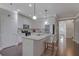 Stylish kitchen features stainless steel appliances, granite counters, and center island at 486 Crestmont Ln, Canton, GA 30114