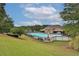 Community pool with lounge chairs and umbrellas at 486 Crestmont Ln, Canton, GA 30114
