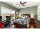 Bright bedroom with hardwood floors, ceiling fan, large window, and desk area at 700 Piedmont Ne Ave # 4, Atlanta, GA 30308