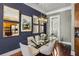 Stylish dining room with modern light fixture, glass table, decor mirrors, and view of adjacent rooms at 700 Piedmont Ne Ave # 4, Atlanta, GA 30308