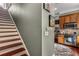 View of stairs and the nearby kitchen/dining area, featuring wood cabinets and stainless appliances at 700 Piedmont Ne Ave # 4, Atlanta, GA 30308