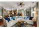 Open living space features hardwood floors, stylish furniture, and an adjacent kitchen area with breakfast bar at 700 Piedmont Ne Ave # 4, Atlanta, GA 30308