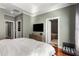 Cozy primary bedroom featuring tray ceiling, with a view to ensuite bathroom and walk-in closet at 700 Piedmont Ne Ave # 4, Atlanta, GA 30308