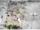 Aerial view of a charming home with a driveway and lush landscaping at 133 Dailey Mill Rd, Mcdonough, GA 30253