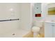 A well-lit bathroom featuring a walk-in shower with grab bar, toilet and sink at 133 Dailey Mill Rd, Mcdonough, GA 30253