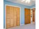 Bedroom featuring louvered closet doors and neutral carpeting at 133 Dailey Mill Rd, Mcdonough, GA 30253