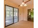 Bright dining area with sliding glass doors to a sunroom and direct access to the kitchen at 133 Dailey Mill Rd, Mcdonough, GA 30253