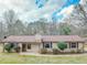 Charming single-story home with a well-maintained lawn and neutral-colored siding and brown trim at 133 Dailey Mill Rd, Mcdonough, GA 30253