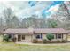 Charming single-story home with a well-maintained lawn and neutral-colored siding and brown trim at 133 Dailey Mill Rd, Mcdonough, GA 30253