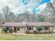 Charming single-story home with a well-maintained lawn and neutral-colored siding and brown trim at 133 Dailey Mill Rd, Mcdonough, GA 30253