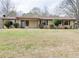 Charming single-story home with a well-maintained lawn and neutral-colored siding and brown trim at 133 Dailey Mill Rd, Mcdonough, GA 30253