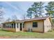 Rear view of a charming home with siding and a chain link fence at 133 Dailey Mill Rd, Mcdonough, GA 30253