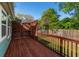 Spacious wood deck with wooden railings, offering a great outdoor space for entertaining and relaxation at 1518 Langston Sw Ave, Atlanta, GA 30310
