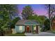 Charming single-story home with a red front door, covered porch, and freshly painted siding at 1518 Langston Sw Ave, Atlanta, GA 30310