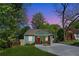 Charming renovated home with green exterior, red front door, and fresh landscaping at 1518 Langston Sw Ave, Atlanta, GA 30310
