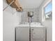 This laundry room features newer appliances, an abundance of light, and built-in shelving at 1518 Langston Sw Ave, Atlanta, GA 30310