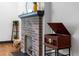 Living room featuring a brick fireplace and vintage record player at 1518 Langston Sw Ave, Atlanta, GA 30310