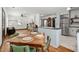 Open floor plan showcasing the kitchen, dining area, and living room with fireplace at 1518 Langston Sw Ave, Atlanta, GA 30310