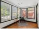 This sitting room is brightly lit with hardwood floors and multiple windows at 1518 Langston Sw Ave, Atlanta, GA 30310