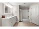 Clean and simple bathroom with marble countertops, white cabinets, and shower-tub combination at 160 Brookhollow Trce, Alpharetta, GA 30022