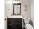 Cozy half bathroom featuring a modern vanity and toilet at 160 Brookhollow Trce, Alpharetta, GA 30022