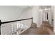 Hallway with natural light, view of the stairway and an open floorplan at 160 Brookhollow Trce, Alpharetta, GA 30022
