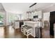 Modern kitchen with granite countertops, stainless steel appliances, and breakfast bar seating at 160 Brookhollow Trce, Alpharetta, GA 30022