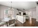 Open kitchen and dining area with granite countertops and stainless appliances at 160 Brookhollow Trce, Alpharetta, GA 30022