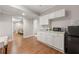 Well-appointed kitchenette featuring white cabinetry, a sink, and a modern microwave at 160 Brookhollow Trce, Alpharetta, GA 30022