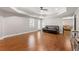 Spacious living room with hardwood floors, tray ceiling, and a comfortable sofa at 160 Brookhollow Trce, Alpharetta, GA 30022