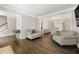 Elegant living room with hardwood floors, neutral paint, and formal dining room at 160 Brookhollow Trce, Alpharetta, GA 30022