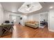 Spacious living room with hardwood flooring and neutral-colored walls, open view to office and bedroom at 160 Brookhollow Trce, Alpharetta, GA 30022