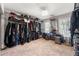 Spacious walk-in closet with custom shelving and ample storage for clothes and accessories at 160 Brookhollow Trce, Alpharetta, GA 30022
