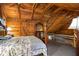 Bedroom featuring natural wood walls and views to a lower loft area at 3401 Clay Rd, Austell, GA 30106