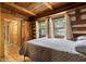 Bedroom features a double window, rustic wood accents and plank door to closet at 3401 Clay Rd, Austell, GA 30106
