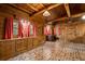 Bedroom featuring brick flooring, wood walls, cabinets, and large windows at 3401 Clay Rd, Austell, GA 30106